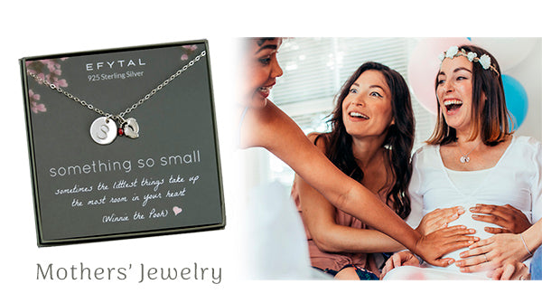 Mom to be wearing our bella baby feet necklace with initial and birthstone and a baby shower.