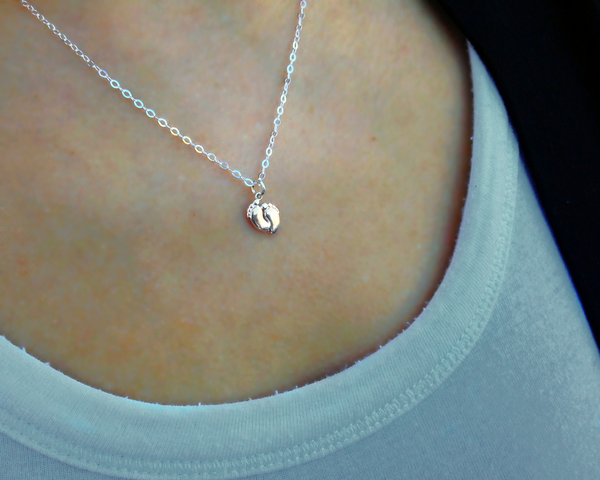 bella tiny feet necklace • something so small