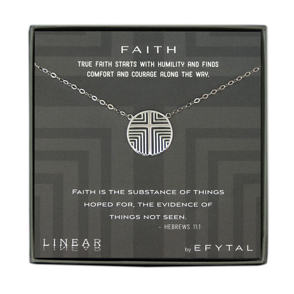 A grey jewelry box containing a grey message card with linear grey cross motif. A sterling silver necklace with a round pendant with the same cross motif pendant rests on the card. The white text on the card reads “FAITH TRUE FAITH STARTS WITH HUMILITY AND FINDS COMFORT AND COURAGE ALONG THE WAY.” At the top and “FAITH IS THE SUBSTANCE OF THINGS HOPED FOR, THE EVIDENCE OF THINGS NOT SEEN. - HEBREWS 11:1 LINEAR by EFYTAL” at the bottom. 