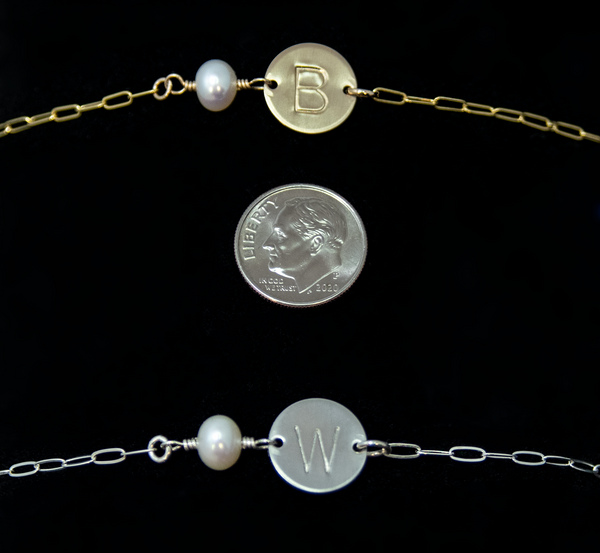 the dainty initial charm is smaller than a dime