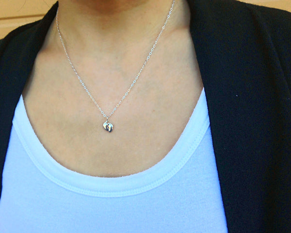 bella tiny feet necklace • something so small