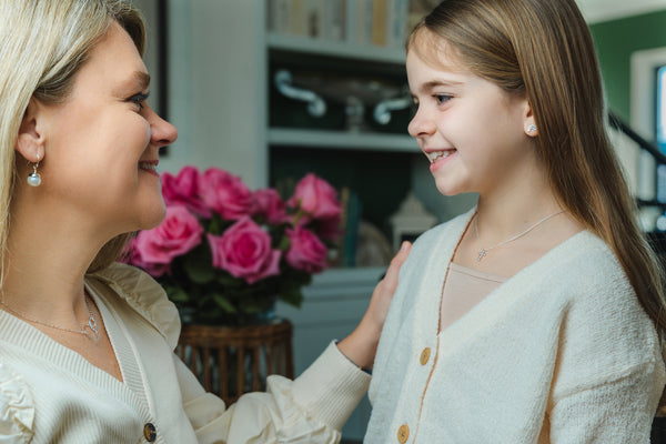 this cute and dainty cross necklace looks lovely on people of all ages