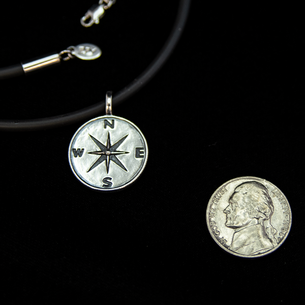 the compass pendant is about the size of a nickel