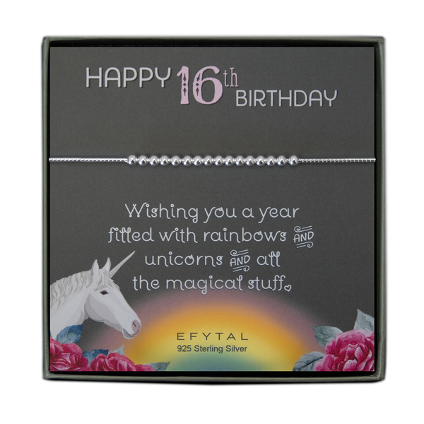 grey jewelry box containing silver bracelet with sixteen round silver beads, placed on a grey card. The bottom left corner of the card has a unicorn and roses, there is a rainbow in the bottom center, and a rose on the bottom right corner. The card reads "Happy 16th birthday" in pink and white font at the top, and "Wishing you a year filled with rainbows and unicorns and all the magical stuff <3" underneath in white. "EFYTAL 925 sterling silver" is in small dark text at the bottom of the card. 