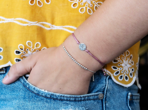 journey compass cord bracelet • adventure is an attitude