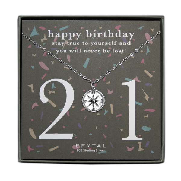 grey jewelry box containing silver necklace with a dimensional compass pendant, placed on a grey card with colorful confetti print and large number 21 in white font. the card reads "happy birthday. stay true to yourself and you will never be lost!" in white font at the top, and "EFTYAL 925 Sterling Silver" in small print at the bottom.