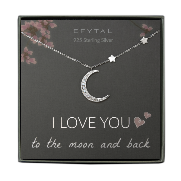 A grey jewelry box contains a grey message card with pink floral motif at the top. A silver necklace with two star stationed beads along the right side and a large crescent moon pendant with embedded CZ stones rests across the card. At the top in white font, the card reads "EFYTAL 925 Sterling Silver." At the bottom, it reads "I LOVE YOU <3 <3 to the moon and back."